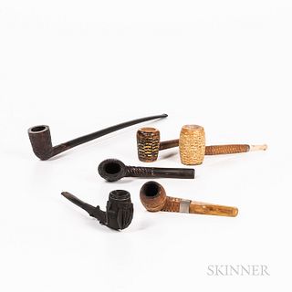 Six Pipes, including three "Corn Cob," one carved black hardwood with shamrock and harp, one "Churchwarden" pipe, and another.
