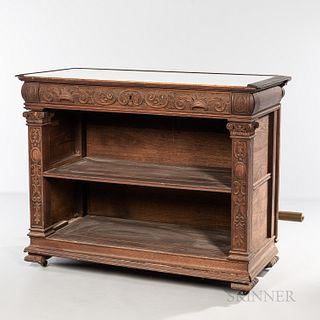 Carved Oak Bar with Brass Footrail, late 19th/early 20th century, with half-round ornamental molding, inset top, and shelves below, ht.