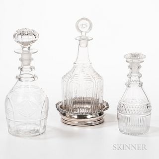 Group of Barware, including three varied decanters, six emerald glass wines, and a silverplate wine coaster.