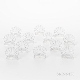 Set of Twelve Baccarat Shell-form Table Place Card Holders, marked.