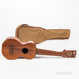 Kumelae Ukulele, in original canvas case, (missing one string, two tuner knobs replaced, scratched initials in body), lg. 21 in.