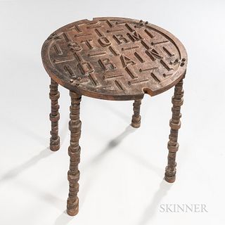 Cast Iron "Storm Drain" Hole Cover Table, on four legs fashioned from cast iron crankshafts.