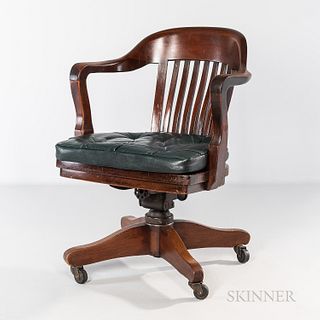 Oak Desk Chair, 20th century, with swivel and tilt mechanism, tufted faux-leather cushion.