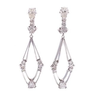 A Pair of Modern Diamond Dangle Earrings in 14K