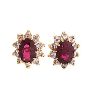 A Pair of Ruby & Diamond Halo Stud Earrings in 14K