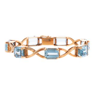 A Blue Topaz "X" Link Bracelet in 18K
