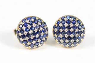Pair of 14 Karat Gold Cufflinks
set with blue sapphires and diamonds
diameter 13/16 inches
20.5 grams