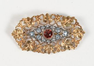 Buccellati 18 Karat Gold Brooch
set with center red stone surrounded by light blue stones
length 1 1/2 inches
4.7 grams
Provenance: Estate of Dr. Thom