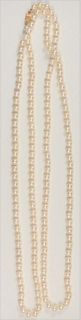 Pearl Single Strand Necklace
with 14 karat gold clasp
length 52 inches
6.9 millimeters