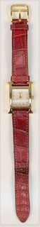 Hermes 18 Karat Gold Ladies Wristwatch
with Hermes 18 karat gold, and red leather band
21.3 millimeters