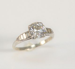 14 Karat White Gold Ring
set with center 1.75 carat diamond
flanked by baguettes
7.5 millimeters