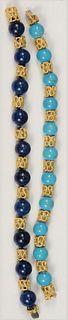 Pair of 18 Karat Gold and Bead Bracelets
one with turquoise, one with lapis, each with open work gold spacers
length 7 1/2 inches and 8 inches
total w