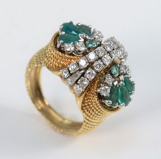 18 Karat Yellow Gold Ring
set with eight emeralds, and thirty-two diamonds
size 6 1/2
15.2 grams