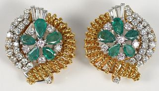 Pair of 18 Karat Gold and Platinum Ear Clips
each set with five pear shaped emeralds, and thirty-two diamonds
18.6 grams