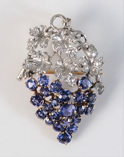 18 Karat White and Yellow Gold Brooch
bunch of grapes with diamonds in the leaves, and blue sapphires as grapes
height 1 1/2 inches
8.8 grams