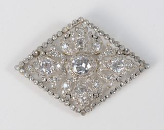 14 Karat White Gold Diamond Brooch
navette shape, outer frame is bezel set with fifty-two European full and single cut diamonds, four fleur-de-lis tri