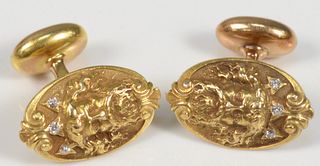 Pair of 14 Karat Gold Cufflinks
with face of man having beard set with three diamonds each
length 18.9 millimeters
6.9 grams