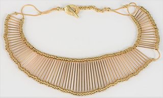 18k Gold Wire Necklace
mounted with gold pins and beads
signed Links, London
height 1 3/4 inches
approximately 128 grams
Provenance: Estate of Marilyn