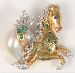 18 Karat Gold and White Horse Brooch
set with emeralds, diamonds, ruby and pearl
height 1 1/2 inches
22.3 grams
Provenance: Estate of Marilyn Ware, St