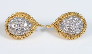 Pair of 14 Karat Gold and White Gold Diamond Earrings
having 3 rope edges, in yellow gold, around a pave set pear shape, white gold diamond, cluster o