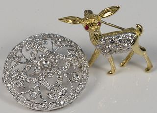 Two Brooches 14 Karat Yellow Gold Deer Brooch
set with diamonds with ruby eyes, plus circular 14 karat white gold and diamond brooch
height 1 inch 
5.