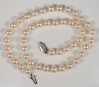 Single Strand of Pearls
with 14 karat white gold clasp
length 16 inches