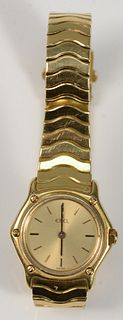 18 Karat Gold Ebel Ladies Wristwatch
with 18 karat gold band
length 6 1/2 inches, 23.3 millimeters
total weight 58.2 grams
