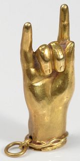 18 Karat Gold Match Safe 
in form of hand with two raised fingers, striker on inside cover
height 2 1/4 inches
17.5 grams