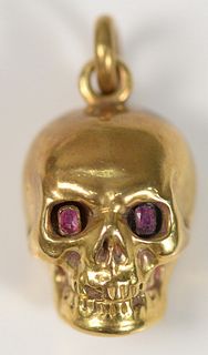 18 Karat Gold Skull Container with Red Stone Eyes
height 1 inch
9 grams