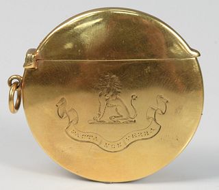 18 Karat Gold Circular Box 
with hinged top marked S.M. & Co., with family crest on front
diameter 1 3/4 inches
20.5 grams