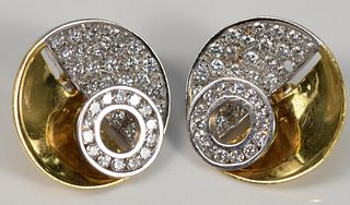Pair of 18 Karat Yellow and White Gold Ear Clips
circular form, with small circle, set with diamonds, (one diamond missing)
in Asprey, Fifth Avenue bo