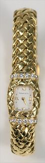 Tiffany & Company 18 Karat Gold Ladies Wristwatch
set with sixteen diamonds, having 18 karat gold mesh band, in original Tiffany & Company box
total w