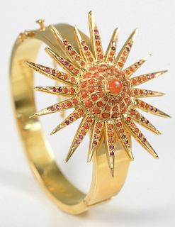 22 Karat Gold Bangle Style Bracelet
set with large star, set with coral, and red stones, one stone missing
50.7 grams