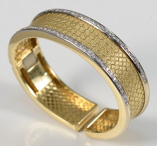 18 Karat Bangle Bracelet in Gold and White Gold 
woven style, with two rows of diamonds and hinged opening
58.9 grams