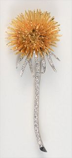 18 Karat Yellow and White Gold Brooch
in form of a flower, stem having inset diamonds
height 2 3/4 inches
22.1 grams