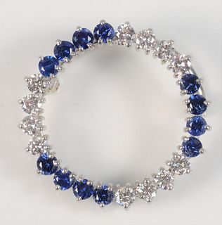 J. E. Caldwell Platinum Circular Brooch set with twelve diamonds, and twelve blue sapphires, #87870diameter 1 inch