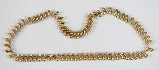 18 Karat Yellow Gold Necklace 
set with seventy-three diamonds
length 15 1/2 inches
69.8 grams