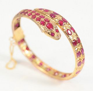 14K Gold Snake Bracelet
set with fifty-seven rubies
total weight 17.8 grams