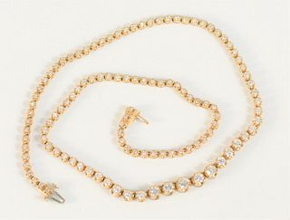 14 Karat Gold Ladies Diamond Necklace
set with 111 diamonds, line style setting
16 inches 
largest approximately .38 carat
smallest approximately .03 