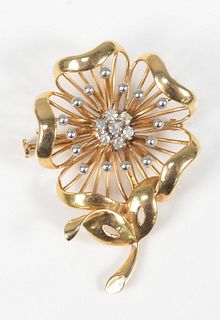 14 Karat Gold Floral Brooch
set with seven diamonds
12.7 grams