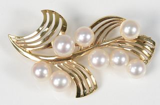 14K Gold Freerform Brooch
set with eight pearls
length 2 1/4 inches
11.8 grams
