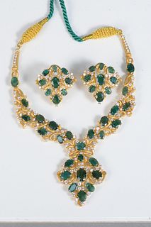 22 Karat Gold Three Piece Set
necklace and earrings set with green stones
93 grams (without string)
