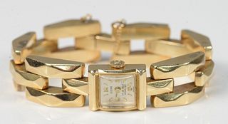 14K Yellow Gold Ladies Wristwatch by Hepa
square gold case, with gold bracelet
23.5 dwt.