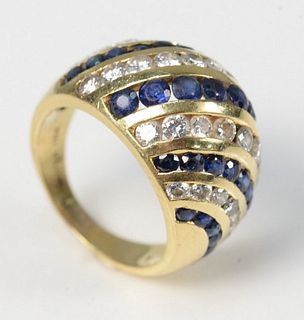 18 Karat Gold Dome Ring
set with blue sapphires and diamonds
signed Nova
size 6 3/4
10.3 grams