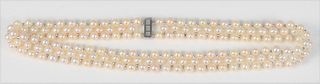 Pearl Three Strand Necklace
with 14 karat white gold clasp
length 18 1/4 inches