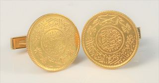 Pair of 14 Karat Gold Cufflinks
mounted with Middle Eastern gold coins
diameter 21.6 millimeters
20.7 grams