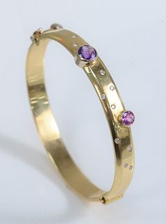 18 Karat Yellow Gold Bangle Style Bracelet
set with amethyst, pink sapphire, and small diamonds
31.6 grams