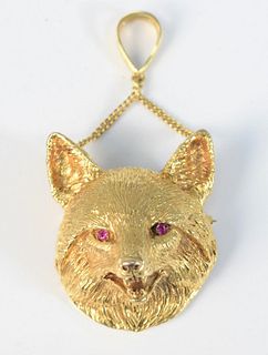 18 Karat Gold Fox Head Pendant/Brooch
having ruby eyes
height 1 3/4 inches
52.4 grams