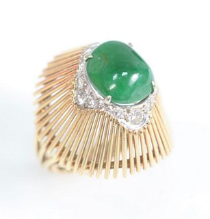14 Karat Gold Ring
set with cabochon cut emerald, surrounded by diamonds and emerald
size 6 1/4
10.6 x 12.3 millimeters