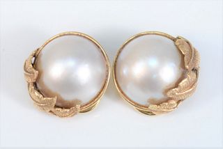 Pair of 14 Karat Gold Earrings 
each set with large Mobe pearls
17 millimeters
total weight 13.6 grams